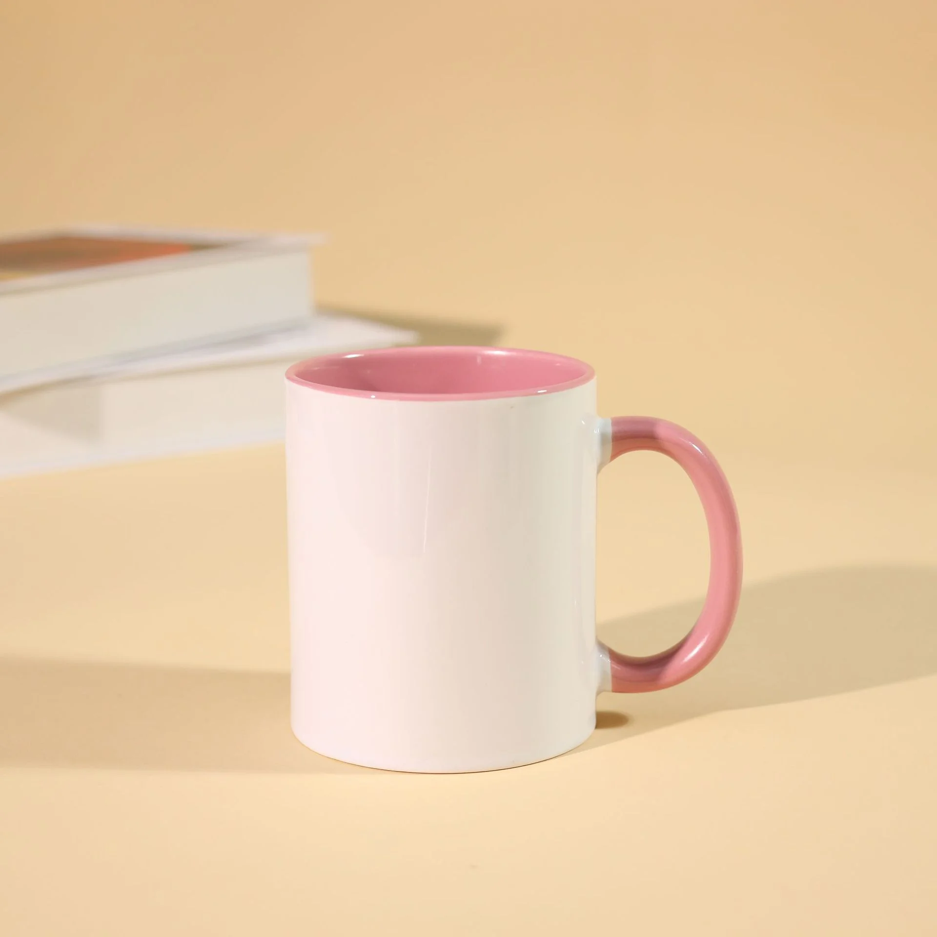 Personalized custom coffee cup with pink handle and rim, ideal for promotional gifting