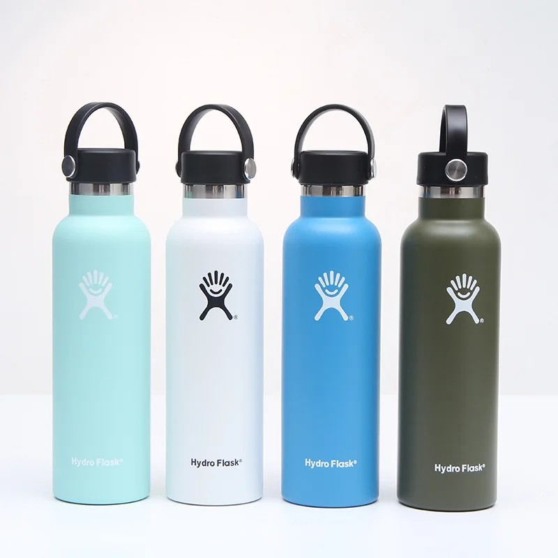 assorted branded water bottles in blue, pink, gray, and black for business branding