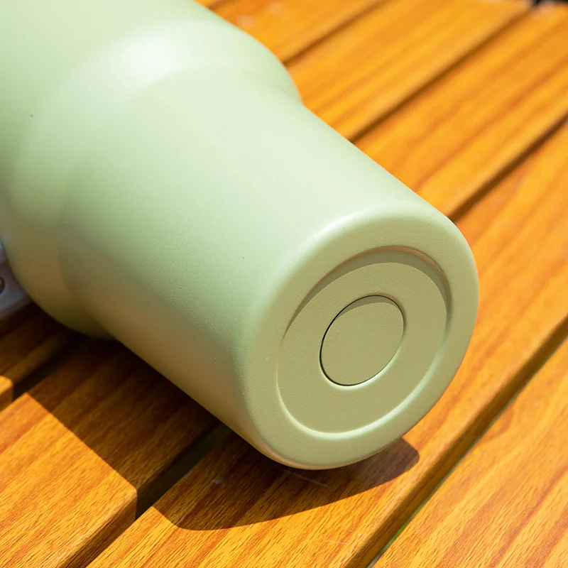 pastel green silicone base water bottle with straw