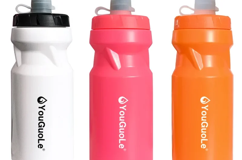 Assorted sports plastic water bottles in white, pink, and orange